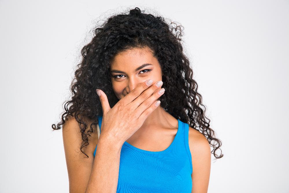 woman covering mouth | cosmetic dentist cookeville tn