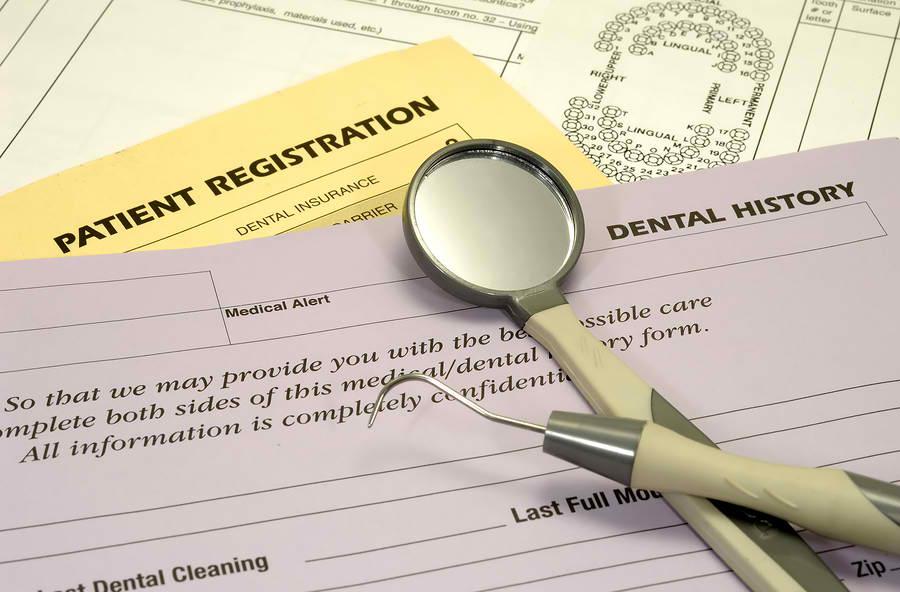 close up of dental payment forms | cosmetic dentist cookeville tn