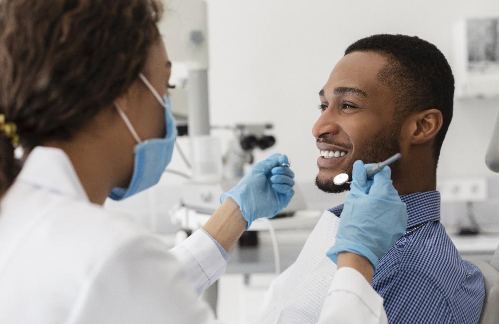 man receiving dentist exam | cosmetic dentist cookeville tn