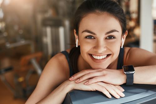 woman with headphones smiling | teeth whitening cookeville tn