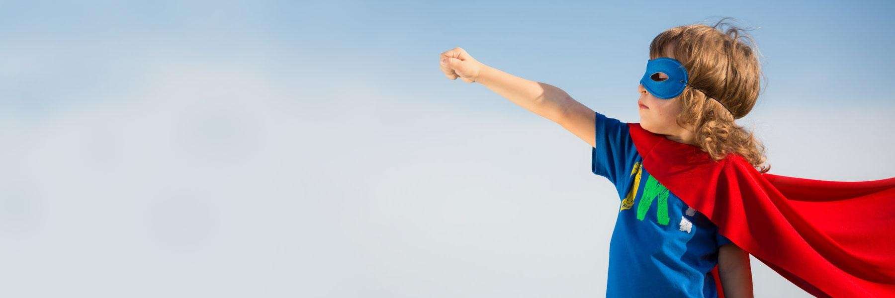 young child with superman cape | dentist cookeville tennessee