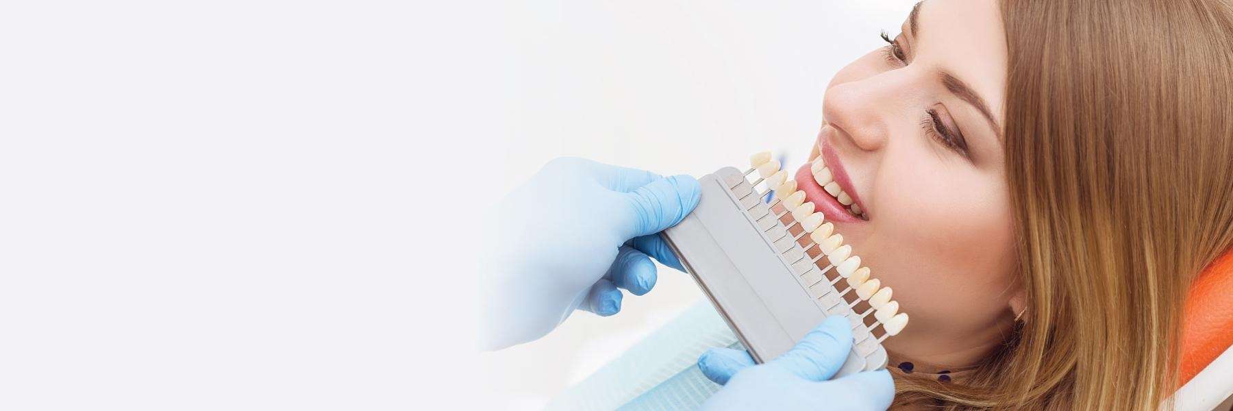 woman picking out tooth shade | dentist cookeville
