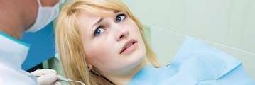 woman looking afraid at dentist | cookeville dentist office