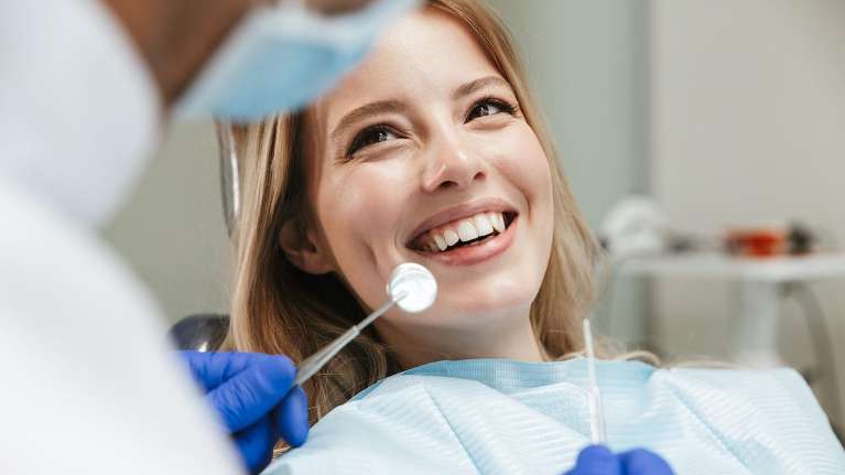 woman receiving dental exam | dental implant cookeville tn