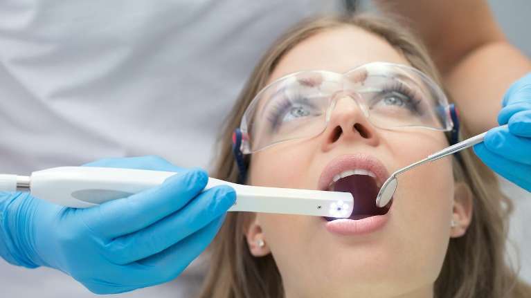 patient receiving dental exam | dental crowns cookeville tn