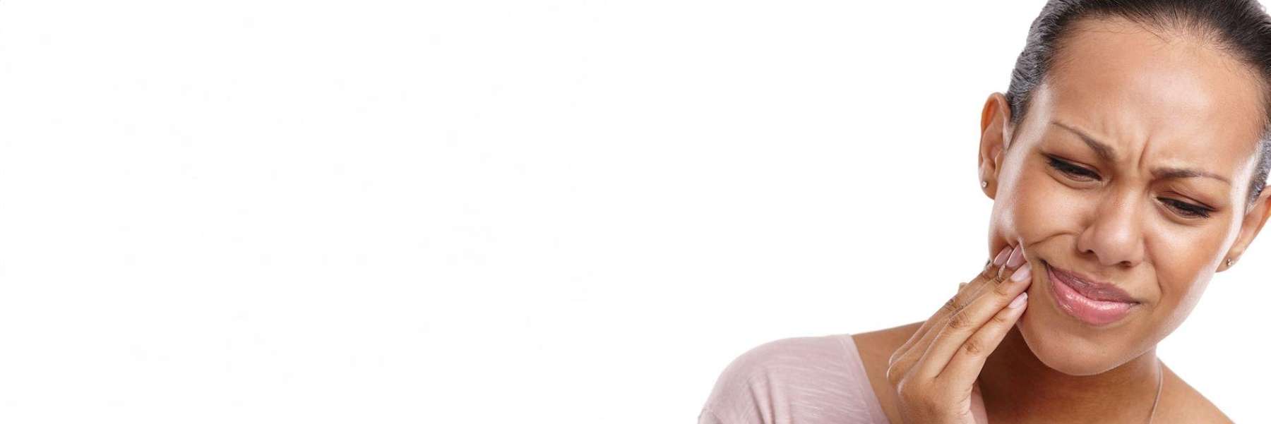 woman in pain holding jaw | dentist cookeville tn