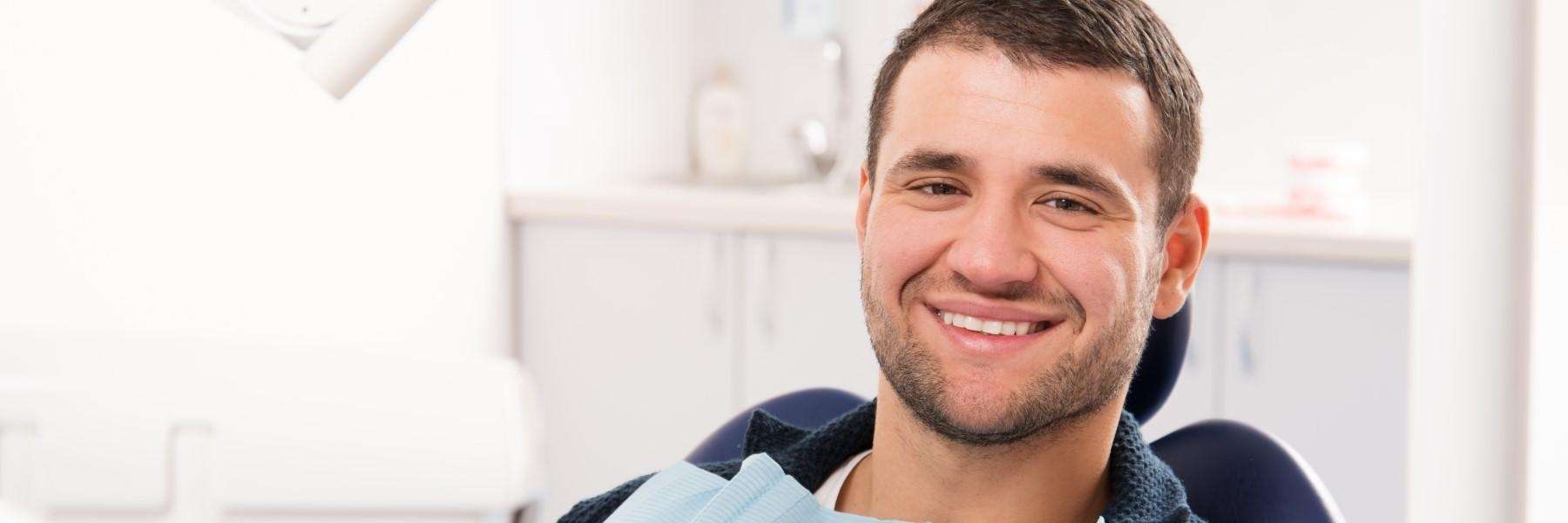 man smiling in dental clinic | dentist cookeville