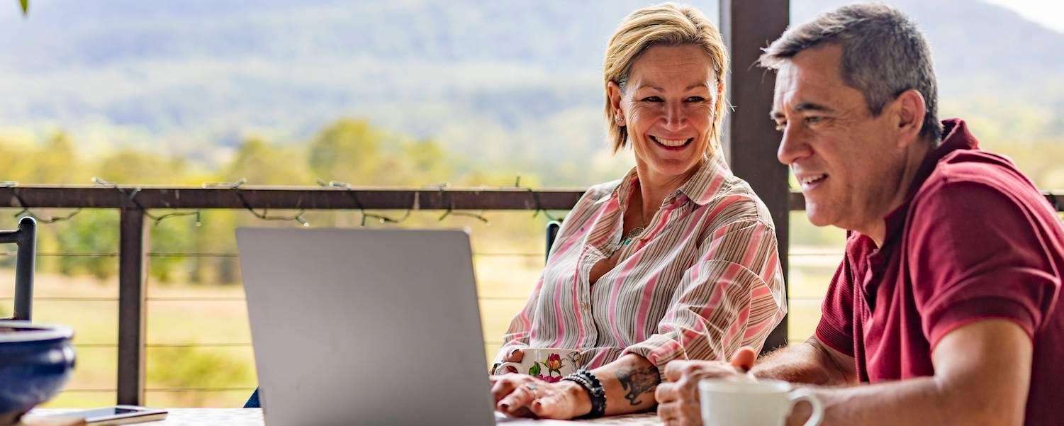 couple using laptop | dental crowns cookeville tn