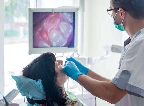 patient looking at intraoral camera | cookeville tn dentist